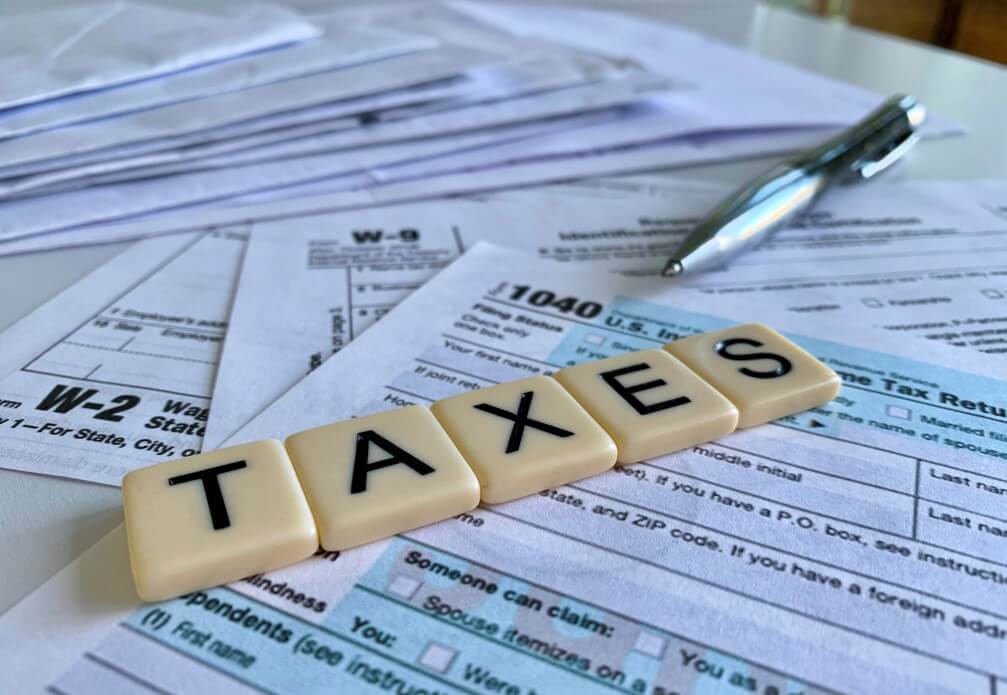 low-angle-of-letter-tiles-with-the-word-taxes-on-a-variety-of-tax-forms-it-s-time-to-start-putting_t20_pRZbjY (1)